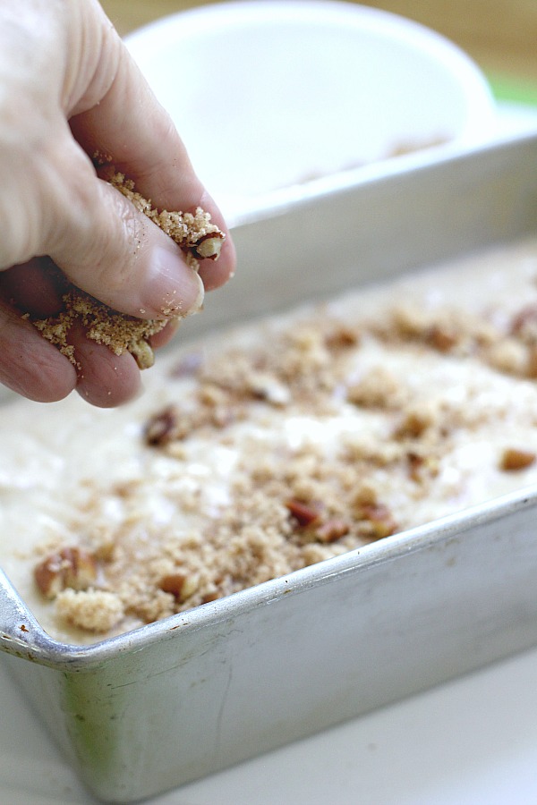 Easy recipe for frosted applesauce bread full of warm flavors of cinnamon, allspice & nutmeg. You don't even need a mixer to make this delicious quick bread.