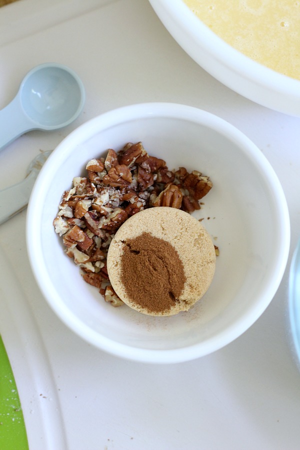 Easy recipe for frosted applesauce bread full of warm flavors of cinnamon, allspice & nutmeg. You don't even need a mixer to make this delicious quick bread.