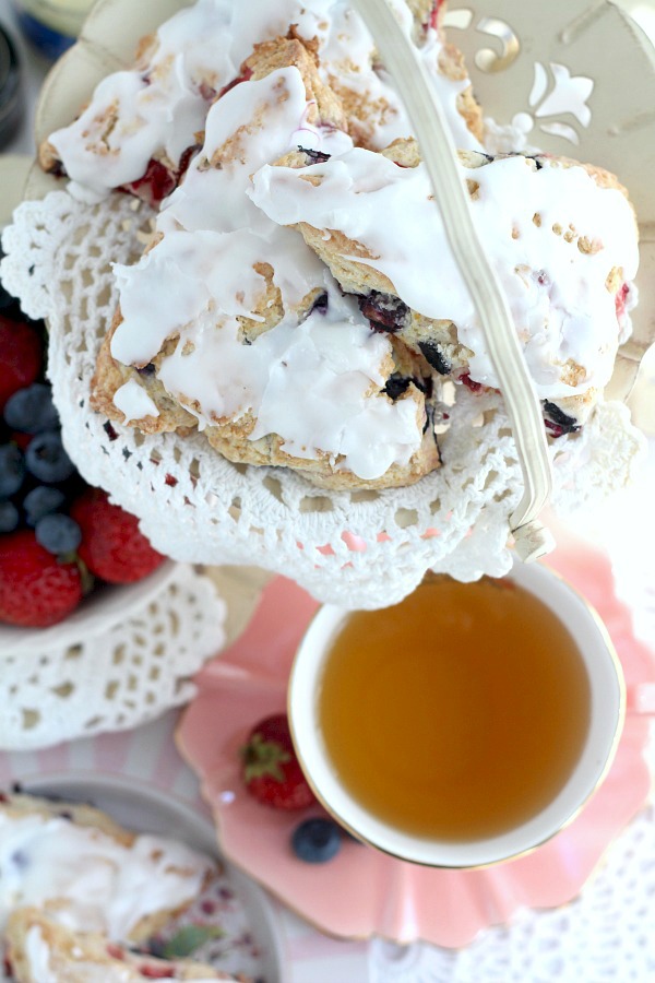 Brighten breakfast or tea time with this easy recipe for frosted Strawberry blueberry scones. Lovely for Mother's Day or to share with friends & coworkers.