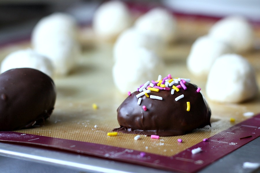 Coconut buttercream Easter eggs are such a happy memory from childhood. I remember how pretty they looked in my Easter basket. They took the place of honor amid the colored hard-boiled eggs, tall chocolate bunny, jelly beans. Try these easy-to-make homemade chocolate covered coconut Easter eggs.