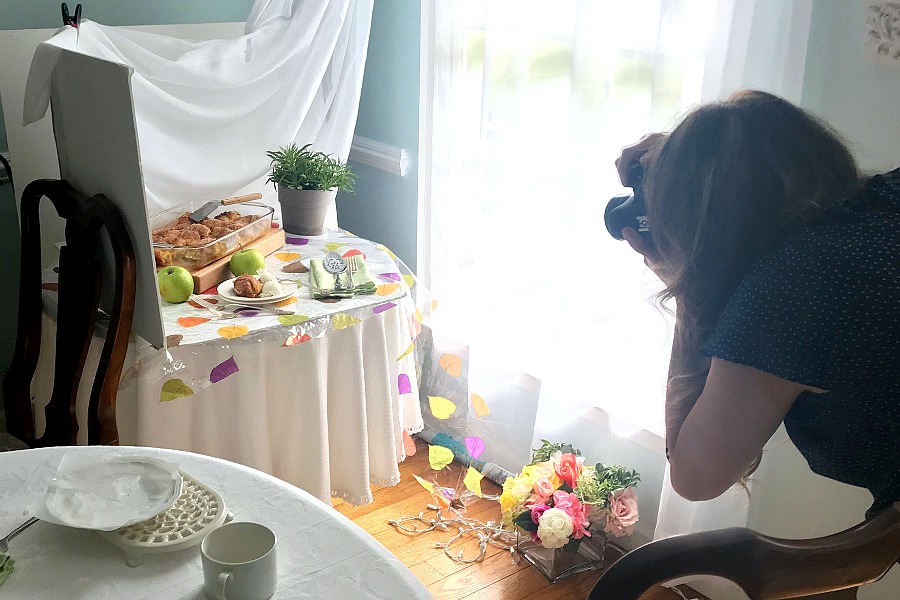 Get great food photography shots that look amazing. Tips for styling, lighting, backgrounds, props, camera equipment and a behind the scenes peek at a food blogger.