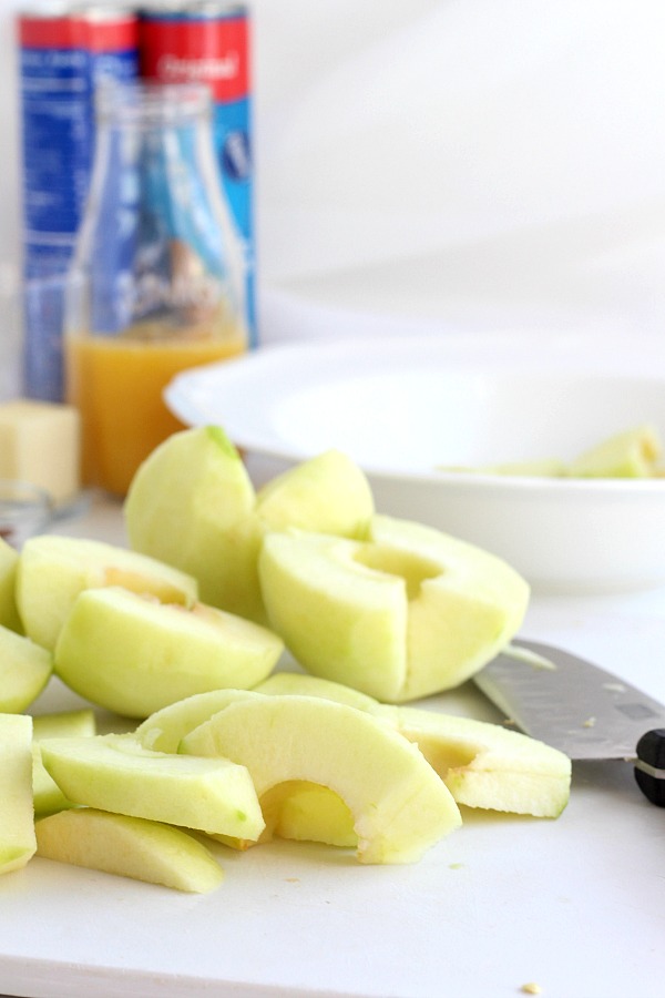 Super easy recipe for autumns favorite fruit, Apple Bundles are made with crescent rolls, cinnamon with a hint of orange. They smell heavenly and are perfect warm from the oven with a scoop of ice cream.