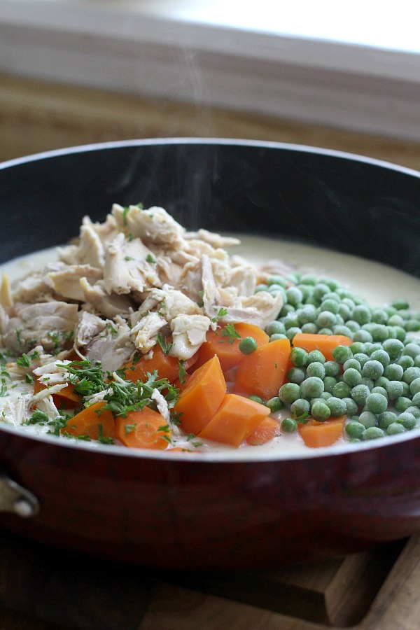 Chicken Pot pie is an all-time favorite comfort food and for good reason. Chunks of tender chicken, carrots and peas in a creamy gravy with a flaky, golden pie crust. A great meal for Sunday dinner or a family weeknight meal. Make it easy and cut prep time by using rotisserie chicken and frozen vegetables.