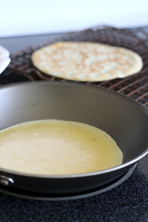 Peaches and Cream Cheese Crepes begins with a simple crepe, then filled with a sweetened cream cheese mixture, fresh sliced peaches, a sprinkling of brown sugar and a pat of butter that is then baked until warmed through. A dusting of confectioners' sugar and topped with whipped cream finishes this lovely dessert.