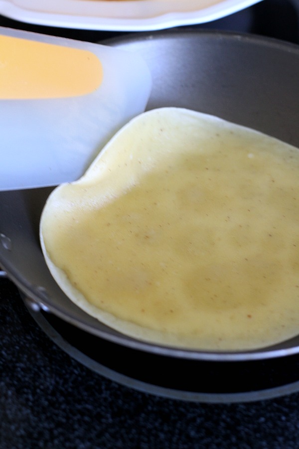 Peaches and Cream Cheese Crepes begins with a simple crepe, then filled with a sweetened cream cheese mixture, fresh sliced peaches, a sprinkling of brown sugar and a pat of butter that is then baked until warmed through. A dusting of confectioners' sugar and topped with whipped cream finishes this lovely dessert.