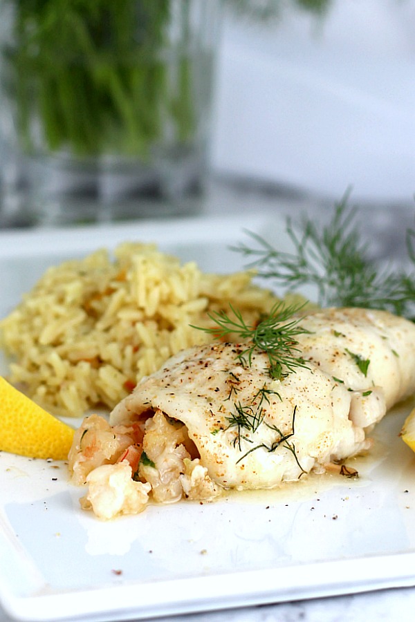 Delicious Shrimp Stuffed Flounder is easy and complany-special. Filled with sauteed veggies and seasonings, it is a favorite fish dinner entree.