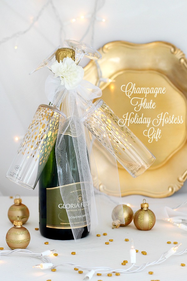 Easy DIY Champagne and flutes holiday gift makes a lovely friend or hostess gift. It takes just a few minutes and looks so festive. Ideal for welcoming the New Year or celebrating a birthday, anniversary, new job, new house or any special occasion.