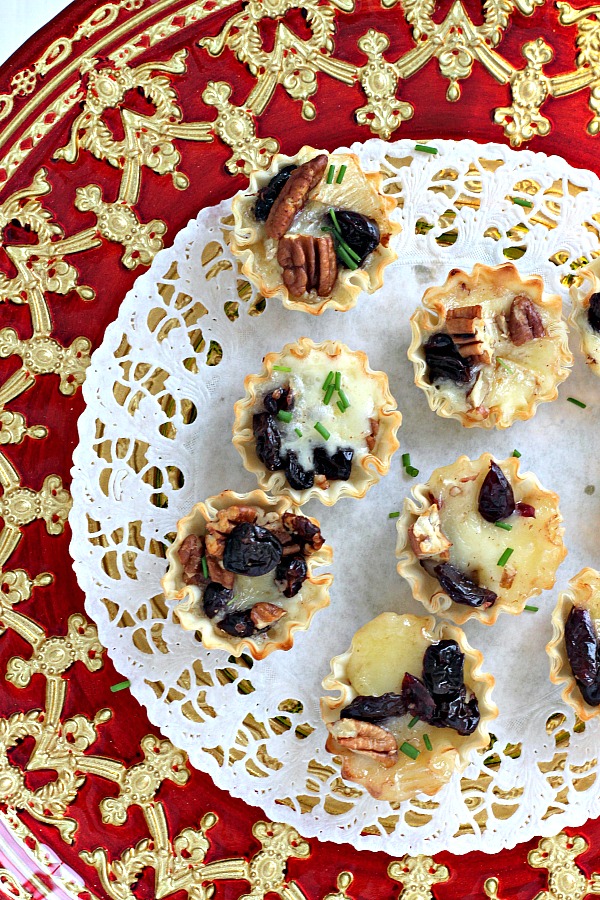 The holidays are a special time of entertaining and parties. Even a small get together with just a few friends is reason enough to set out some tasty tidbits. Brie tartlets with cranberries and cherries is a tasty appetizer that easy, quick and yummy!