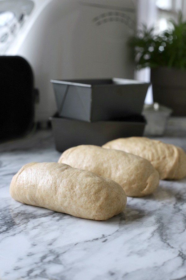 Easy recipe for delicious homemade honey whole wheat bread uses a bread machine to make the dough. Shape into loaves and bake. Perfect for slicing too.