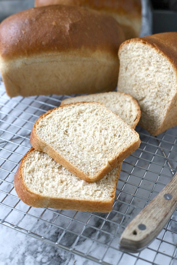 Easy recipe for delicious homemade honey whole wheat bread uses a bread machine to make the dough. Shape into loaves and bake. Perfect for slicing too.