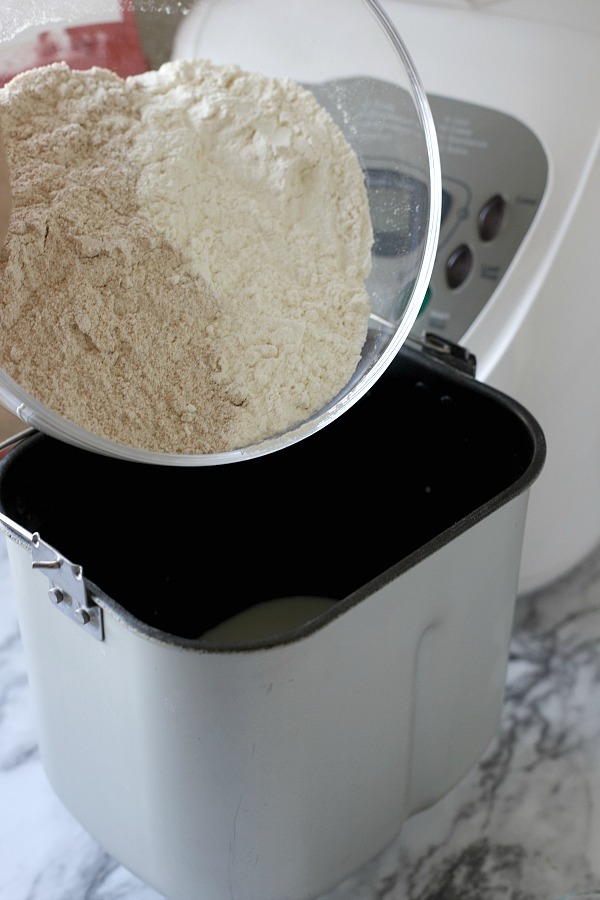 Easy recipe for delicious homemade honey whole wheat bread uses a bread machine to make the dough. Shape into loaves and bake. Perfect for slicing too.