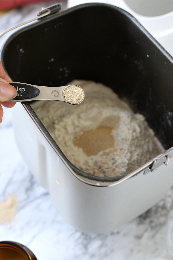 Easy recipe for delicious homemade honey whole wheat bread uses a bread machine to make the dough. Shape into loaves and bake. Perfect for slicing too.