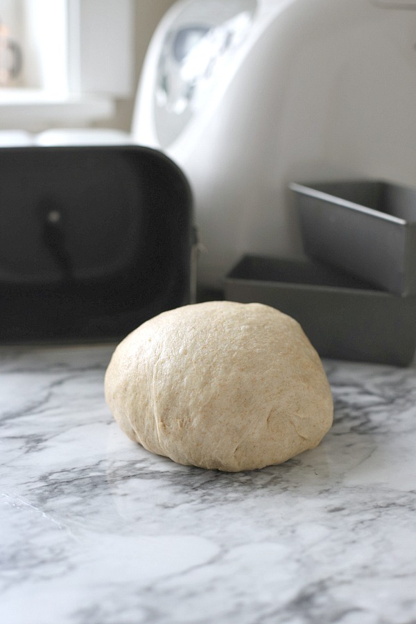 Easy recipe for delicious homemade honey whole wheat bread uses a bread machine to make the dough. Shape into loaves and bake. Perfect for slicing too.