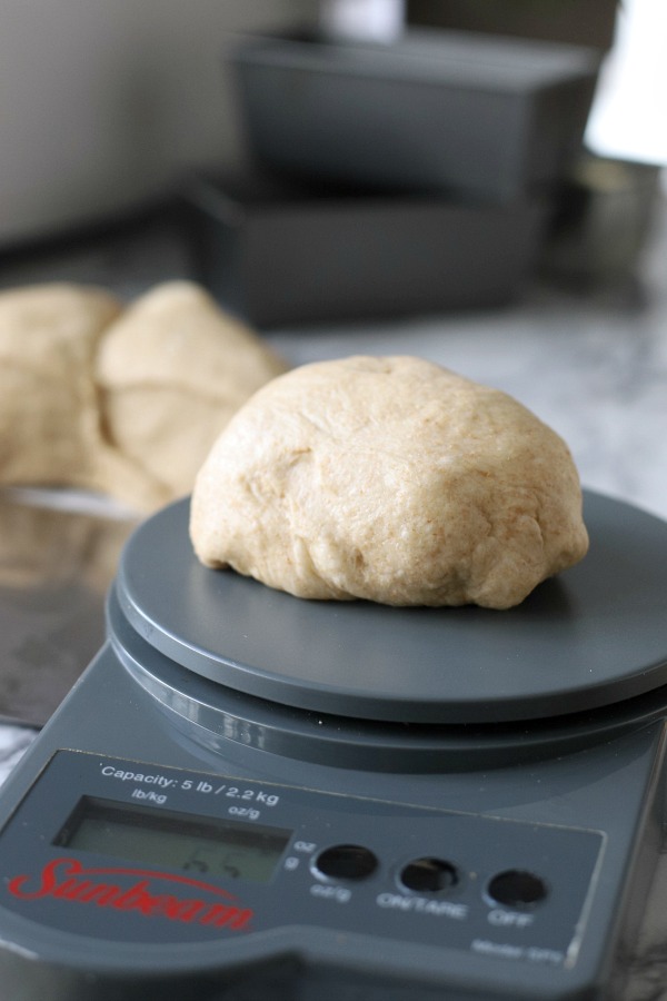 Easy recipe for delicious homemade honey whole wheat bread uses a bread machine to make the dough. Shape into loaves and bake. Perfect for slicing too.