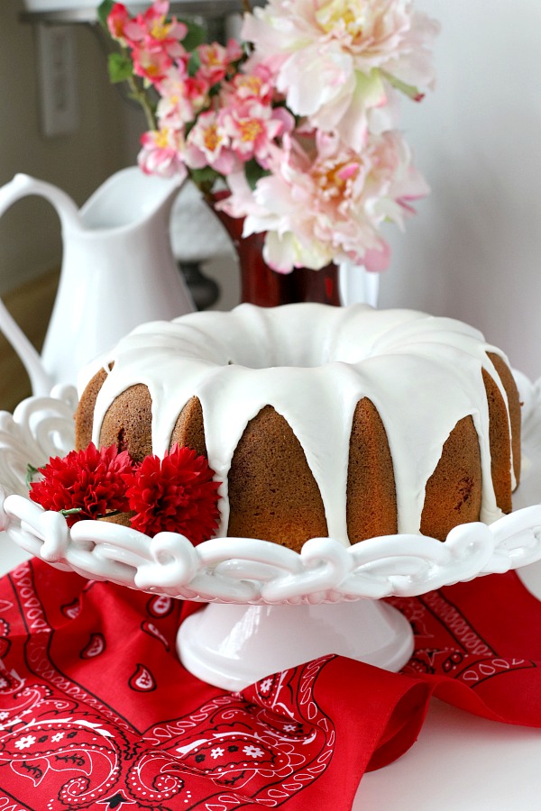 From scratch recipe for a moist red velvet marbled cake made in a Bundt pan has a lovely icing just right for Valentine's Day or celebrating a birthday.