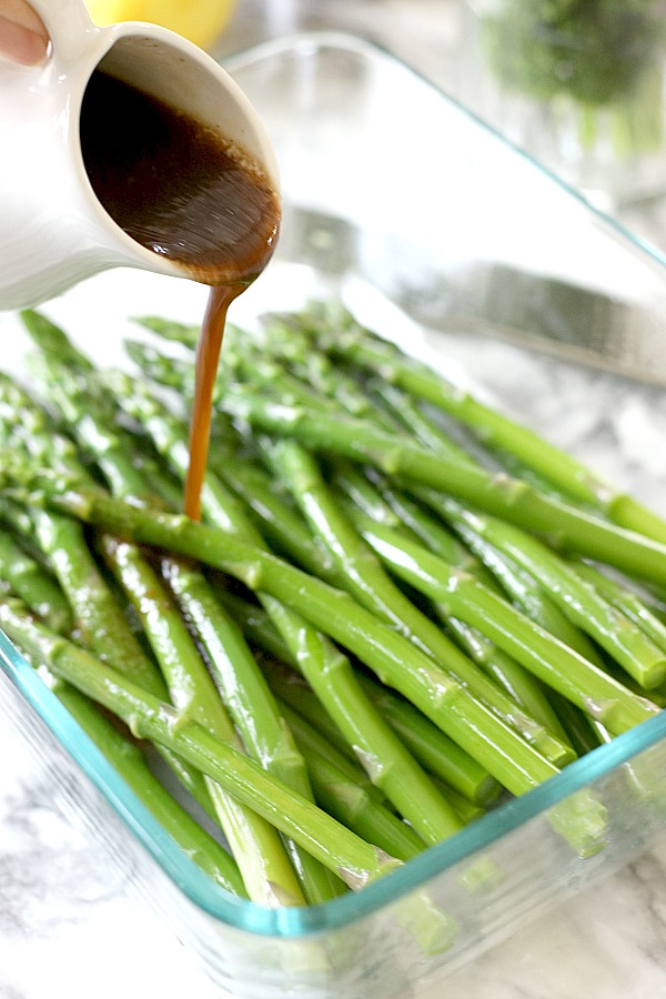 Fresh and delicious asparagus in a balsamic vinaigrette marinade is tender yet crunchy with a bright flavor from lemon zest. So easy to make with just a quick blanching. Pour on the salad dressing marinade and refrigerate until serving. A lovely Easter or brunch side dish.