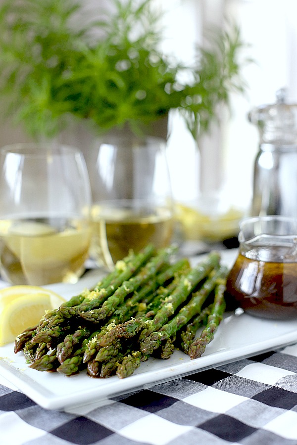 Fresh and delicious asparagus in a balsamic vinaigrette marinade is tender yet crunchy with a bright flavor from lemon zest. So easy to make with just a quick blanching. Pour on the salad dressing marinade and refrigerate until serving. A lovely Easter or brunch side dish.