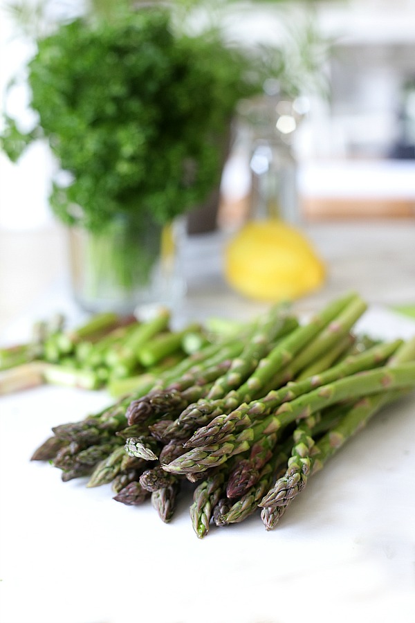 Fresh and delicious asparagus in a balsamic vinaigrette marinade is tender yet crunchy with a bright flavor from lemon zest. So easy to make with just a quick blanching. Pour on the salad dressing marinade and refrigerate until serving. A lovely Easter or brunch side dish.