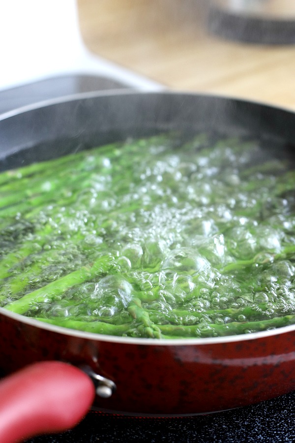 Fresh and delicious asparagus in a balsamic vinaigrette marinade is tender yet crunchy with a bright flavor from lemon zest. So easy to make with just a quick blanching. Pour on the salad dressing marinade and refrigerate until serving. A lovely Easter or brunch side dish.