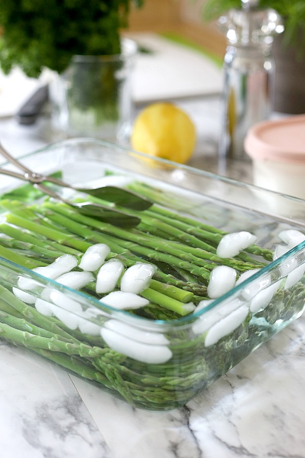 Fresh and delicious asparagus in a balsamic vinaigrette marinade is tender yet crunchy with a bright flavor from lemon zest. So easy to make with just a quick blanching. Pour on the salad dressing marinade and refrigerate until serving. A lovely Easter or brunch side dish.