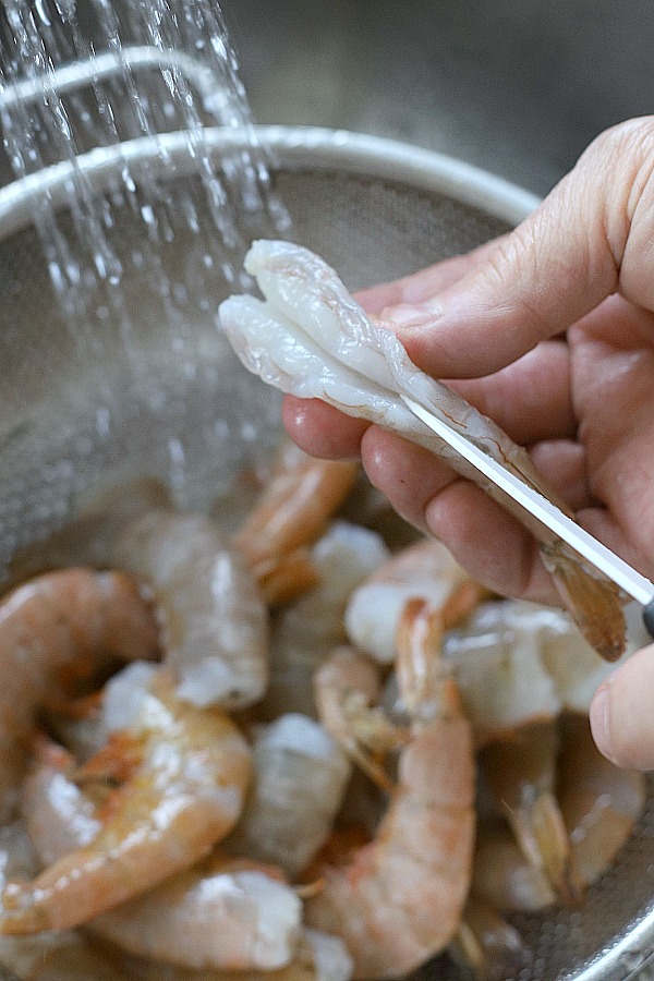 Baked shrimp scampi is a super easy recipe! Arrange shrimp in a baking dish and top with a buttery herb mixture. Place in oven for a few minutes and enjoy a hot and bubbly, perfectly cooked dish elegant for your next dinner party or holiday meal.