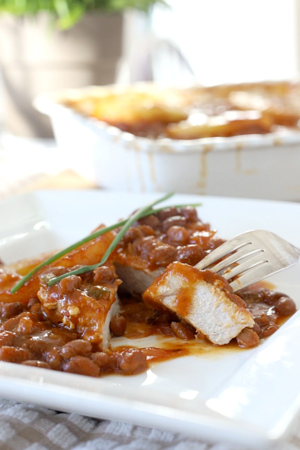 Easy recipe for Hawaiian pork chops and baked beans gets so much flavor from the addition of pineapple, brown sugar and molasses. Great weeknight dinner or potluck dish.  