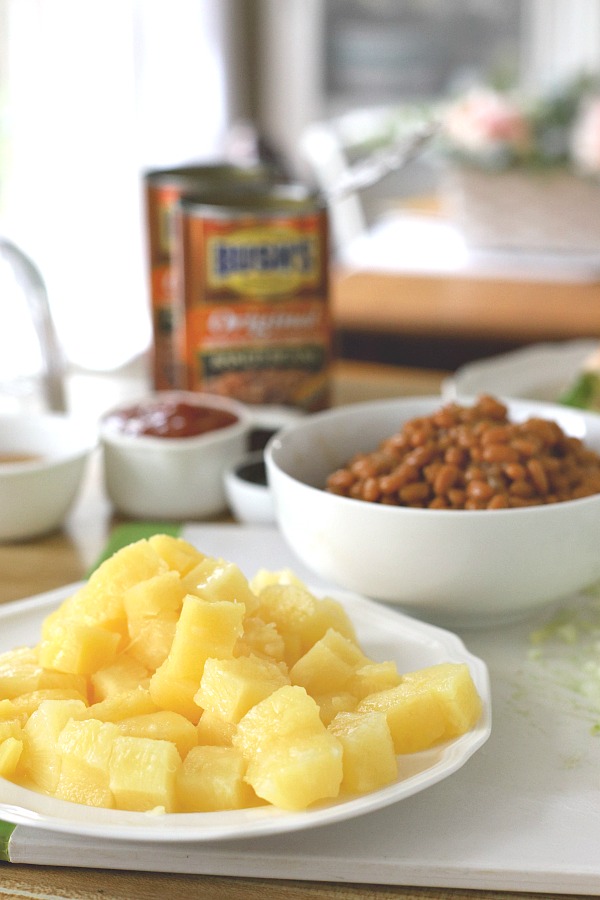 Everyone's favorite cookout side, Hawaiian Baked Beans with pineapple, molasses and brown sugar is quick and easy. Make this recipe on the stove top or bake in the oven. A perfect side for burgers and hotdogs.