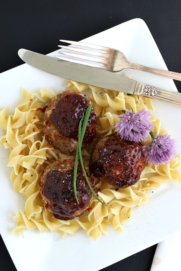 Baked ham balls are a great way to use leftover holiday ham for delicious combination of ham and ground beef topped with BBQ sauce. Serve the easy recipe with noodles, pasta or rice.