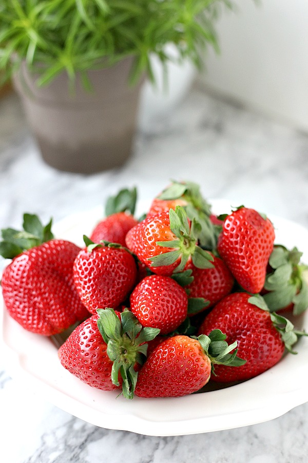 Chocolate covered strawberries are the perfect dessert for 4th of July or patriotic celebrations. Easy no-bake recipe for melting chocolate and decorating.