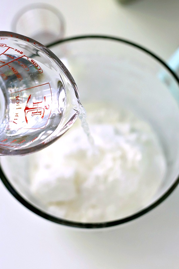 A light dessert and easy recipe for orange angel food cake begins with a box mix. Poke holes throughout the baked cake and pour in Jell-O. Top with whipped topping and serve.