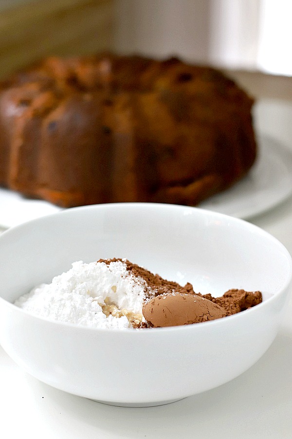 Silky chocolate frosting top a decadent banana chocolate chip bundt cake. Moist and delicious and perfect for birthday and holiday celebrations.  