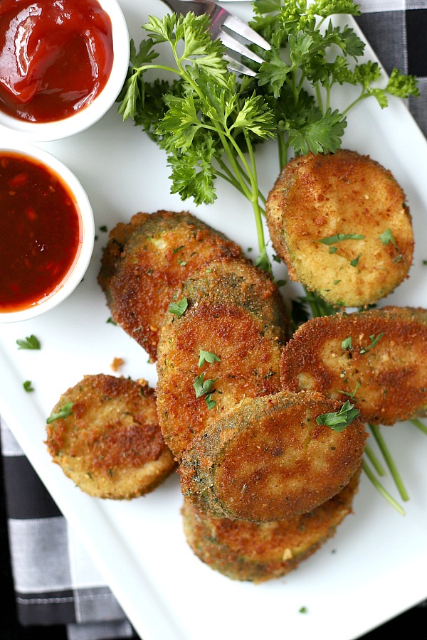 A summertime favorite, breaded fried zucchini is a great side or appetizer. Easy recipe using just a few ingredients and cooked in a skillet until golden brown and crispy.