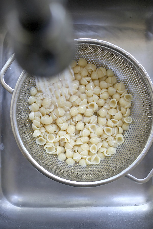 How to make pasta crab salad with veggies, basil, seasonings and fete cheese in a light dressing.