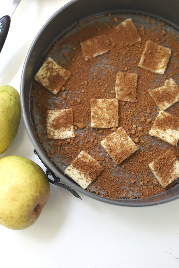 Easy step-by-step recipe for spiced pear upside down cake. Caramelized pears top a moist cake with wonderful spices so perfect for fall and Thanksgiving dessert.