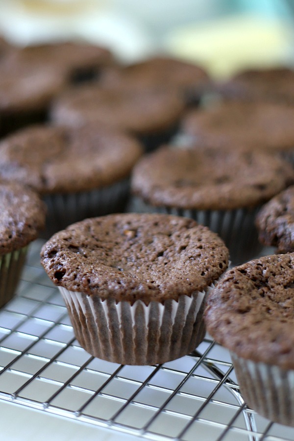 Easy step-by-step recipe for making super moist chocolate zucchini cupcakes with a creamy peanut butter frosting.