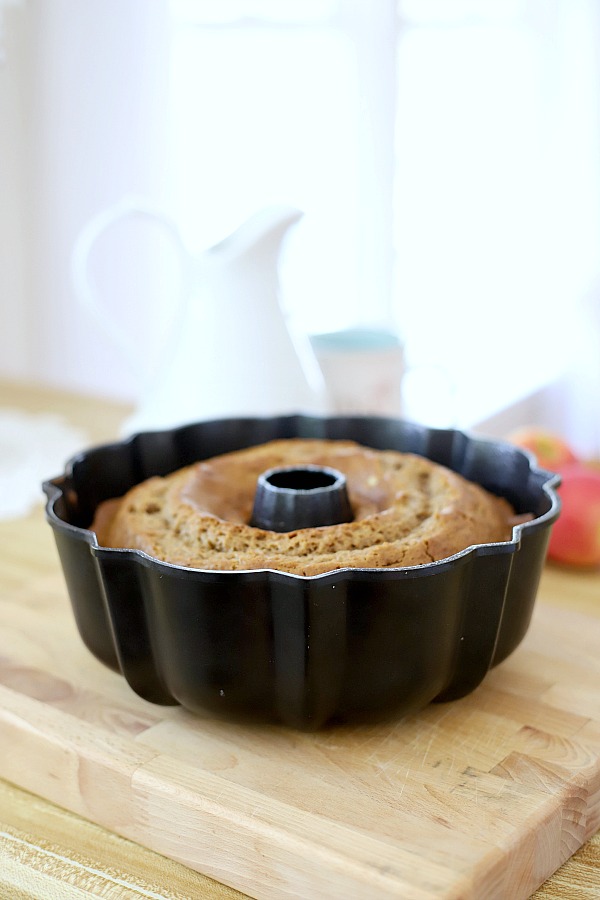 Moist and delicious, applesauce cake is amazing with a sweet, caramel topping! An easy, old-fashioned recipe perfectly spiced fall apple dessert.