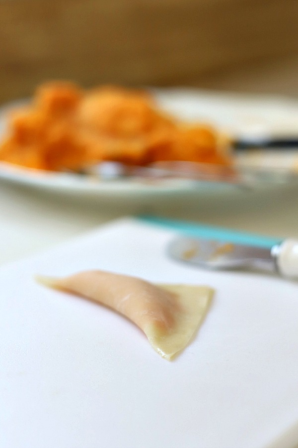 Sweet potato ravioli are pouches of filling in wonton wrappers, served with sage infused cream. An elegant vegetarian dinner entrée sure to please!