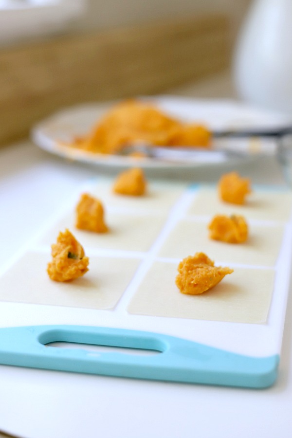 Sweet potato ravioli are pouches of filling in wonton wrappers, served with sage infused cream. An elegant vegetarian dinner entrée sure to please!