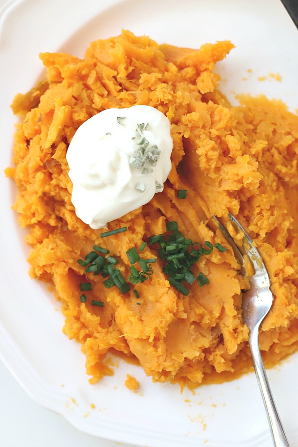 Sweet potato ravioli are pouches of filling in wonton wrappers, served with sage infused cream. An elegant vegetarian dinner entrée sure to please!