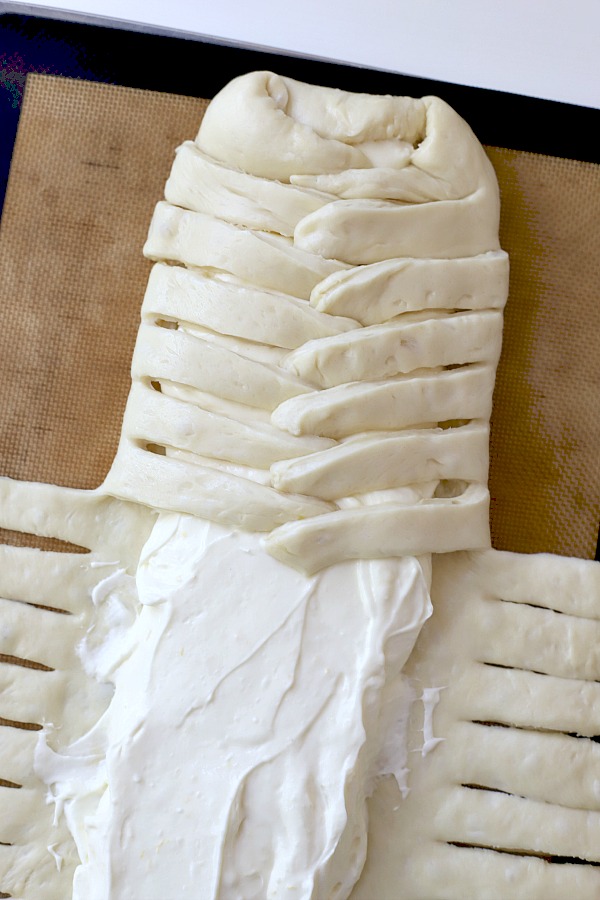 Step-by-step directions for easy cream cheese bread from yeast dough using a bread machine. A light and fluffy Danish with sweetened cheese filling is perfect for breakfast, as a snack or even dessert.