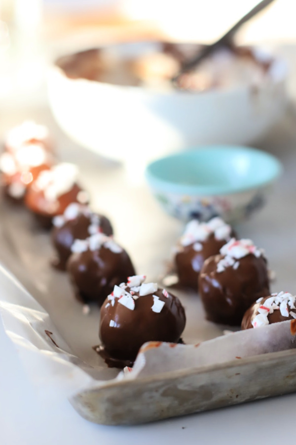 Oreo Cookie balls are super chocolaty with a fun minty flavor. An easy recipe that is no-bake and a favorite addition to your Christmas and holiday cookie tray.