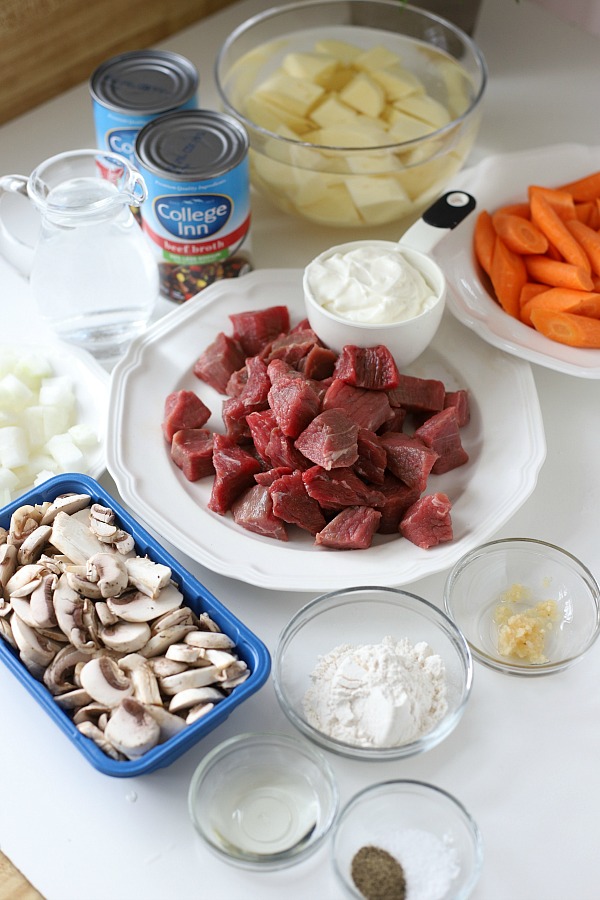 Easy recipe for comforting Stroganoff Stew is filled with chunks of beef, potatoes, carrots and mushrooms in a rich sour cream gravy.