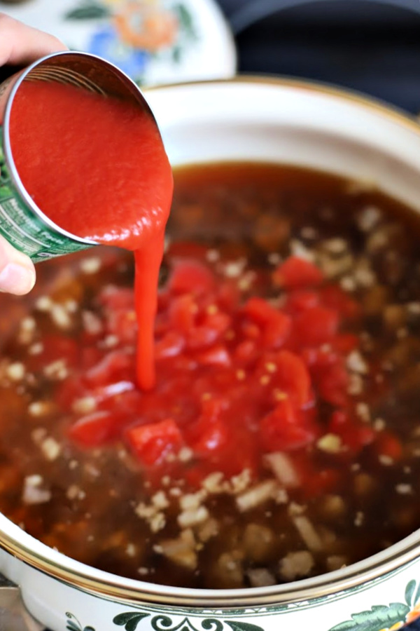 Easy recipe for robust and flavorful Italian sausage soup is a meal in a bowl. Tender vegetables with sausage and tortellini in a tomato broth will warm you soul and tummy.