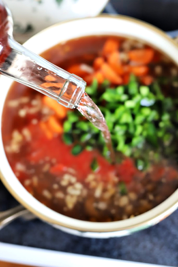 Easy recipe for robust and flavorful Italian sausage soup is a meal in a bowl. Tender vegetables with sausage and tortellini in a tomato broth will warm you soul and tummy.