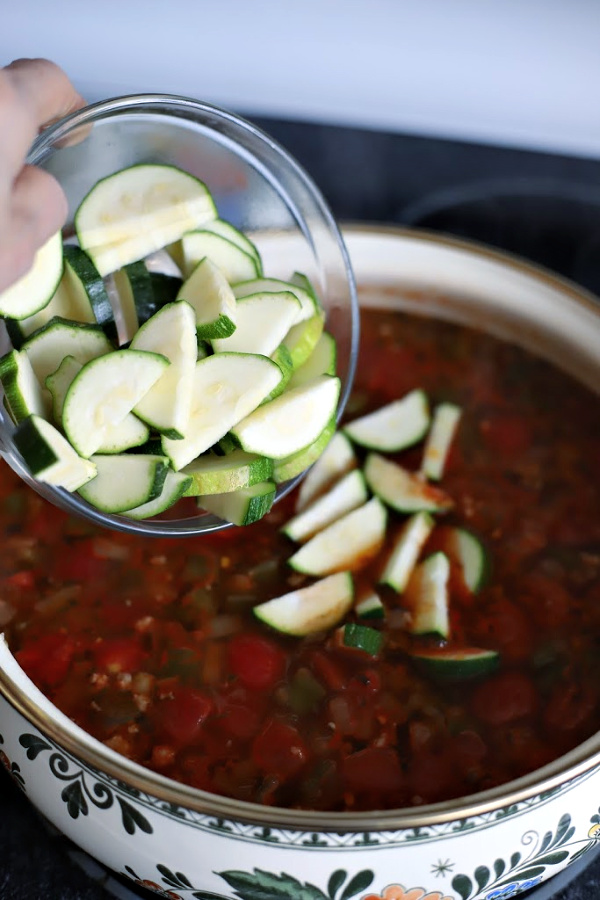 Easy recipe for robust and flavorful Italian sausage soup is a meal in a bowl. Tender vegetables with sausage and tortellini in a tomato broth will warm you soul and tummy.