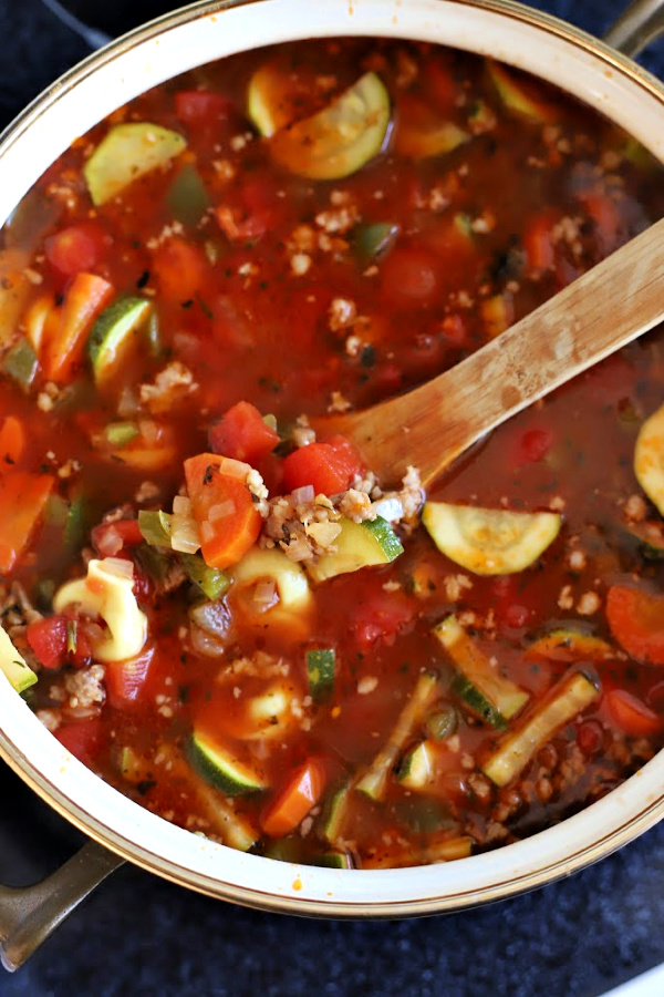 Easy recipe for robust and flavorful Italian sausage soup is a meal in a bowl. Tender vegetables with sausage and tortellini in a tomato broth will warm you soul and tummy.