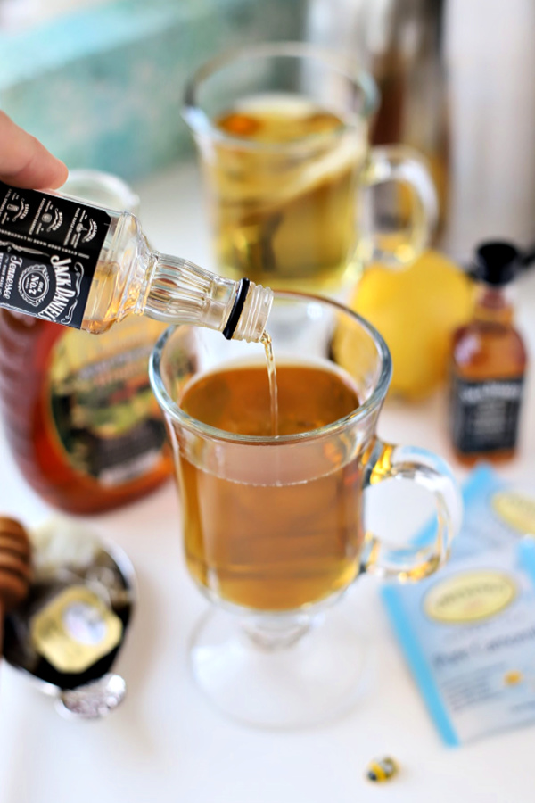 Make a very easy recipe for Hot Toddy when a cold or the flu has you down. It is warm and tasty with whiskey, tea, honey and lemon to help relieve symptoms so you can rest and feel better.