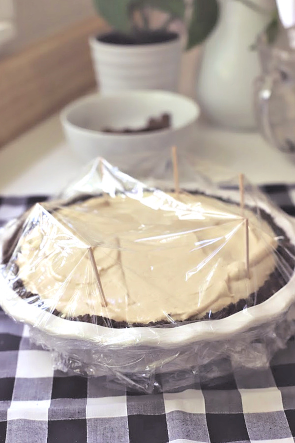 Easy recipe for no-bake peanut butter pie with cream cheese and whipped topping in a heavenly chocolate crust. Creamy, frosty and easily made from scratch!