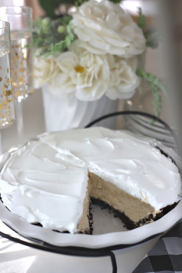 Easy recipe for no-bake peanut butter pie with cream cheese and whipped topping in a heavenly chocolate crust. Creamy, frosty and easily made from scratch!