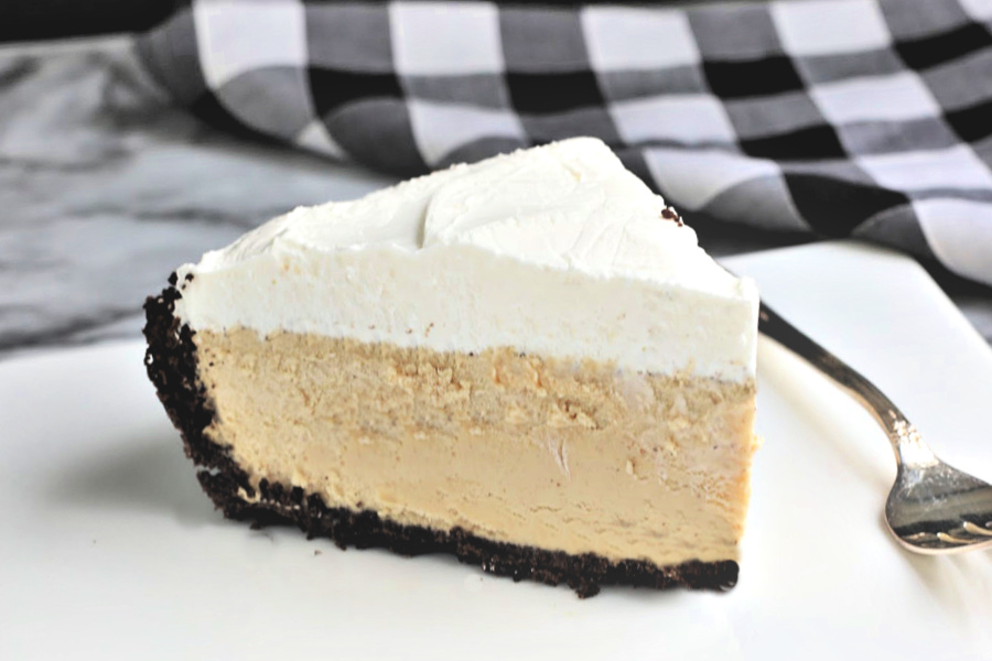 Easy recipe for no-bake peanut butter pie with cream cheese and whipped topping in a heavenly chocolate crust. Creamy, frosty and easily made from scratch!